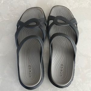 Black Crocs sandals. In good used condition. Size 7.
